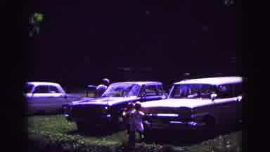 Galena Illinois USA (1967): Children Play Outside Around Vintage Cars And A Park
