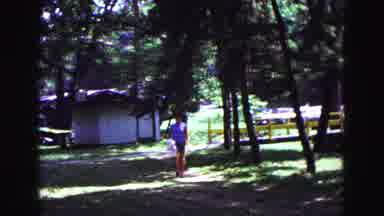 Galena Illinois USA (1967): A Person Walking Towards The Camera With Something In
