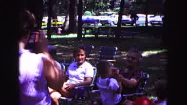 Galena Illinois USA (1967): Adults In Lawn Chairs Interacting With Young Children