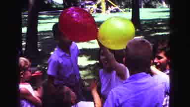 Galena Illinois USA-1967: Children Playing A Game With Red And Yellow Balloons