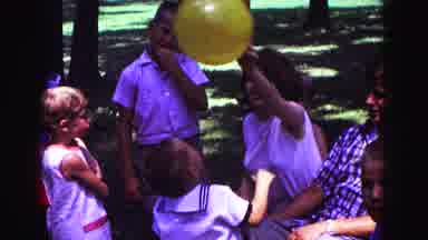 Galena Illinois USA (1967): A Lady With Two Little Kids Playing With Balloons