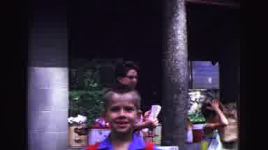 Galena Illinois USA (1967): Boy Smiling In Foreground And Middle Aged Woman