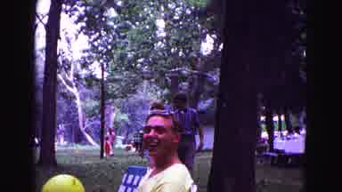 Galena Illinois USA-1967: Man Tossing Yellow Balloon At Park Picnic