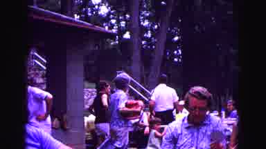 Galena Illinois USA (1967): Old Man Waves At Camera While Women Prepare Musical