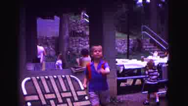 Galena Illinois USA (1967): Little Boy Bbn Walking Down Street People Having Party