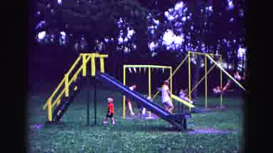 Galena Illinois USA (1967): Many Kids Playing Together On A Playground In A Sunny