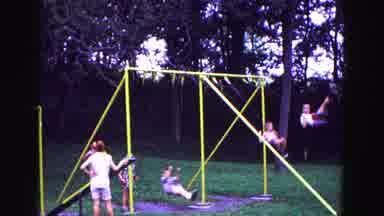 Galena Illinois USA (1967): Lots Of Young Children Swinging On A Yellow Swing Set