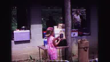 Galena Illinois USA (1967): A Little Girl Walking To People At A Picnic Sitting At