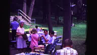 Galena Illinois USA (1967): Small Group Of People Relax Outside On Chairs And Talk