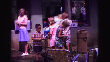Galena Illinois USA (1967): A Young Boy Wanders Around A Cookout With His Young