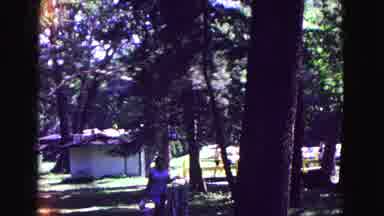 Galena Illinois USA (1967): People Walking With Bags And Kids Playing With A