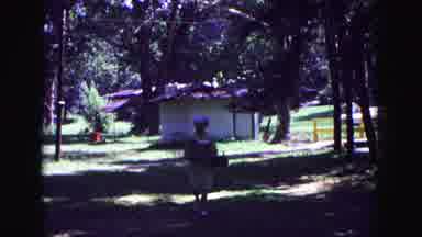 Galena Illinois USA (1967): Old Woman Walking Through The Trees With Her Family