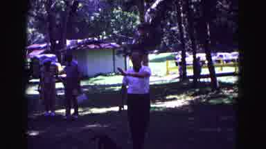 Galena Illinois USA (1967): Man Wearing White Shirt Walks With Brown Dog On Leash