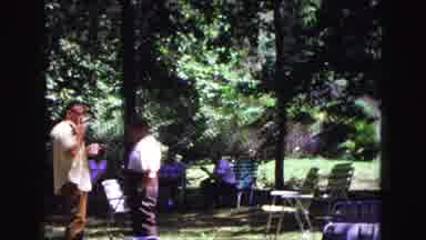 Galena Illinois USA (1967): Two People Talking At A Campsite In The Forest