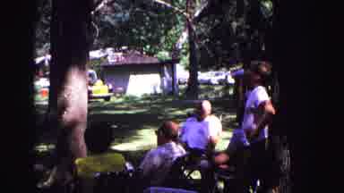 GALENA ILLINOIS USA-1967: People Relax In Park With Boy Drinking Soda