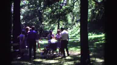Galena Illinois USA (1967): Group Of People In Wooded Area Talking While One Sits