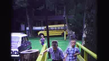 Galena Illinois USA (1967): Cars In A Parking Lot And Kids Running Toward The