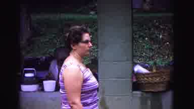 Galena Illinois USA (1967): Woman In Striped Purple Shirt Stands Still Before