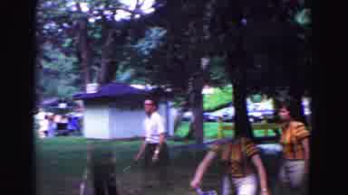 Galena Illinois USA (1967): A Woman Running Outdoors With A Tennis Racket During A