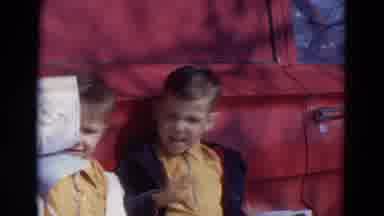Lincoln Nebraska (1967): Two Boys Dressed In Yellow Shirts Standing Next To A Car