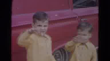 Lincoln Nebraska (1967): Brothers Wave To Camera Next To The Very Modern Red Car