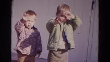 Lincoln Nebraska-1967: Two Boys Shield Eyes From Sun In Driveway