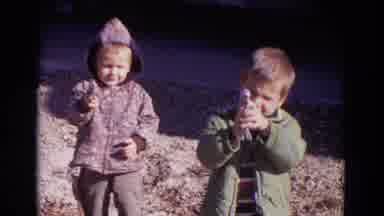Lincoln Nebraska (1967): Two Little Boys Pose For The Camera While Playing With