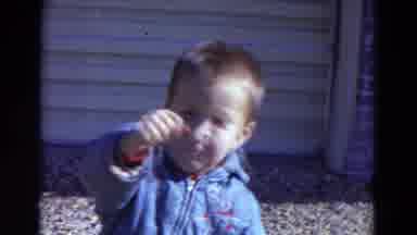 Lincoln Nebraska (1967): Very Small Boy Waves His Way To Camera With Other