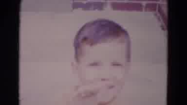 Lincoln Nebraska (1967): Footage Of Your Boy Waving At Camera While Sitting On The
