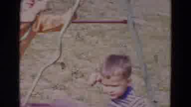 Lincoln Nebraska (1967): Two Little Boys Are Playing Outside On A Swing Set In The