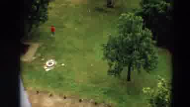Minnesota US (1967): Aerial View Of A Person Walking Across A Garden Wearing A Red