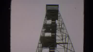 Minnesota US (1967): A Large Watchtower Two Teenagers Getting Into A Van And A