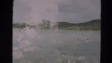 Minnesota US (1967): Traveling With A Car Near The Lake Surrounded By Mountains
