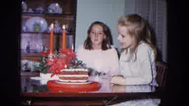 New Mexico USA (1967): A Young Girl Blowing Out Candles On Her Cake For Her