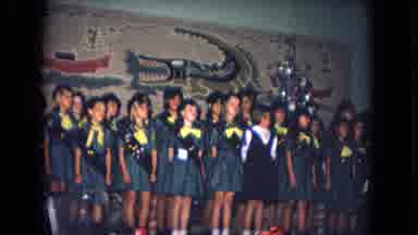 New Mexico USA (1967): Girl Guide Choir Dressed In Green Uniforms Sings In A Hall