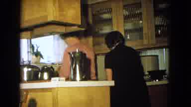 New Mexico USA (1967): Two Adult Women Doing Chores In The Kitchen In A House