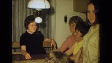 New Mexico USA (1967): A Family Playing Games Together Around The Table Being