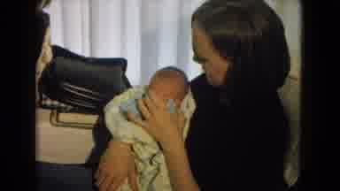 New Mexico USA (1967): Newborn Being Held For The First Time By Family Member