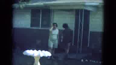New Mexico USA (1967): Two Women Are Just About To Leave The House One Is Fixing