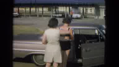 New Mexico USA (1967): Women In Parking Lot At Beach In Dresses And Bathing Suit