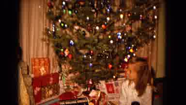 New Mexico USA (1967): Kids Sitting Around A Christmas Tree With Presents Under It