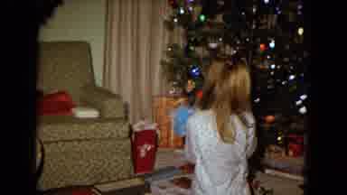 New Mexico USA (1967): People In Pyjamas Joyfully Unwrapping Christmas Presents