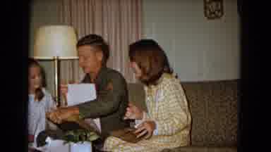 New Mexico USA (1967): Army Man Family & Man Is Showing Gift To His Family