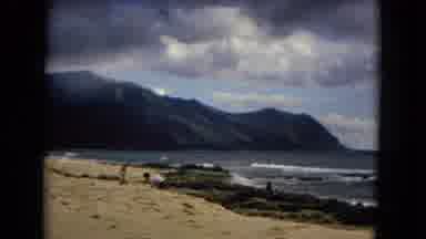 New Mexico USA (1967): The Beach Has A Lot Of Waves A Rock And People Having Fun