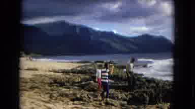 New Mexico USA (1967): Three People Walking On Top Of Some Coastal Rocks Near The