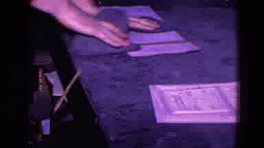 Trenton New Jersey (1967): Someone Scrubbing What Looks Like Paper On A Desk With