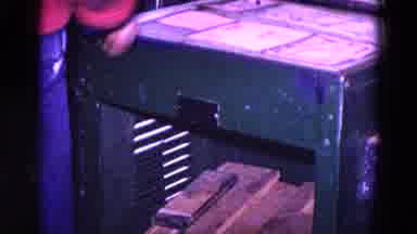 Trenton New Jersey (1967): Man Puts Something In Machine And Appears To Be Forging