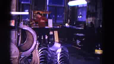 Trenton New Jersey (1967): Man Working At A Mechanic Shop And Taking A Break And