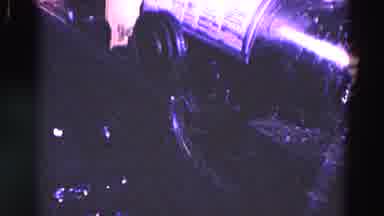 Trenton New Jersey (1967): A Person Putting A Round Metal Tube In A Machine