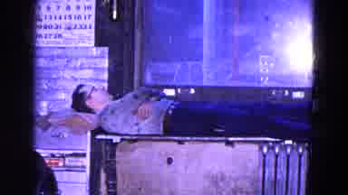 Trenton New Jersey (1967): Man Lies On Makeshift Bed In A Metal Work Factory On